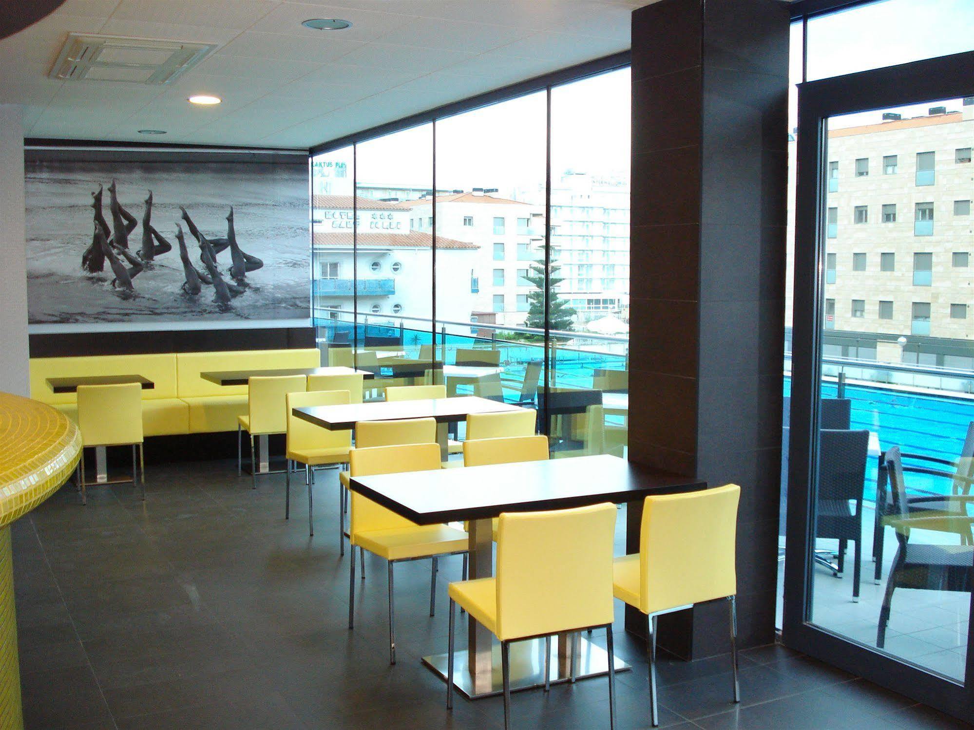 Sant Jordi Boutique Hotel Calella Exterior foto Interior of a McDonald's restaurant in Prague, Czech Republic