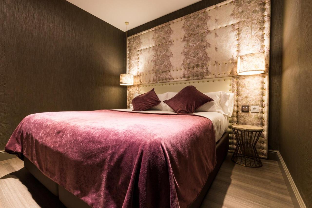 Sant Jordi Boutique Hotel Calella Exterior foto A bedroom at the hotel
